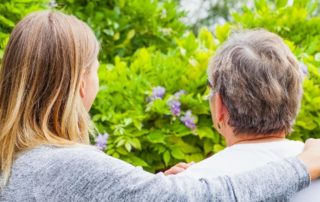 A daughter lovingly acts as her mother's informal caregiver.