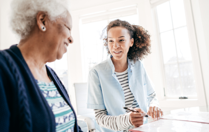 Working for an agency, like this caregiver who’s with a client, can be a choice that leads to a good job.
