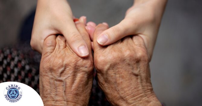 Younger hands hold older ones, representing the care and compassion of caregiving and how caregivers can help, even in ways like implementing stroke prevention strategies.