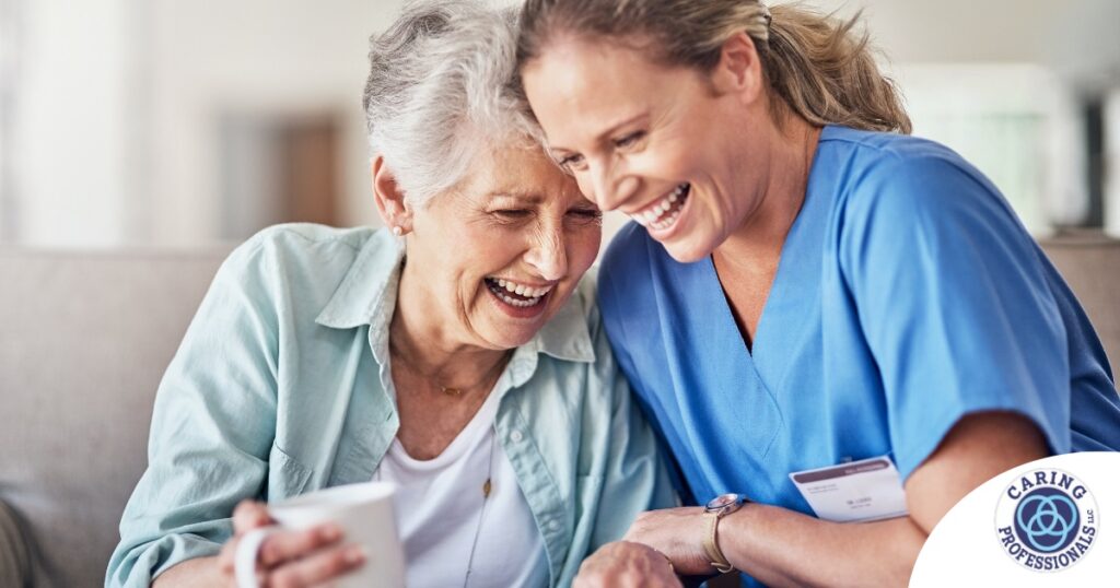 A caregiver laughs with a client representing how good social skills can help professional caregivers.