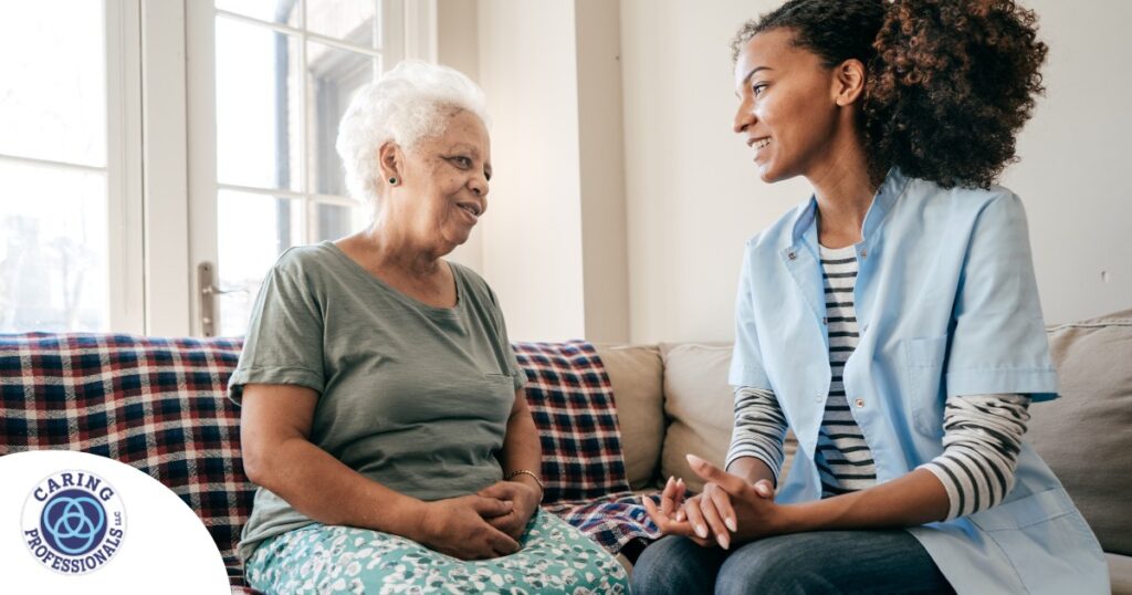 A caregiver sits and spends time with a client, representing how non-medical home care can benefit older loved ones.