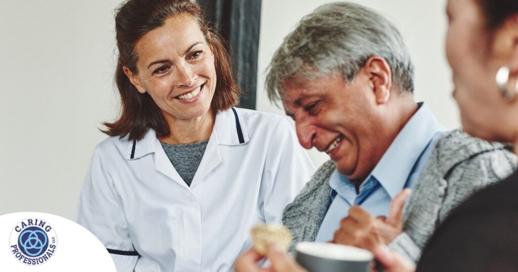 A woman smiles while with clients showing how you can enjoy senior caregiver jobs.