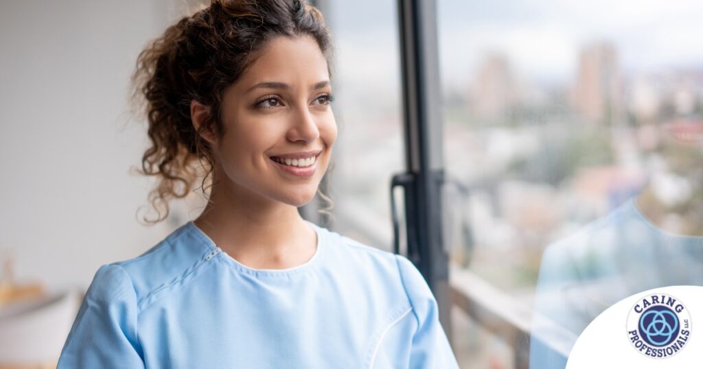 A woman smiles while looking ahead hopefully, showing the positive outlook that planning for a home care career can bring.