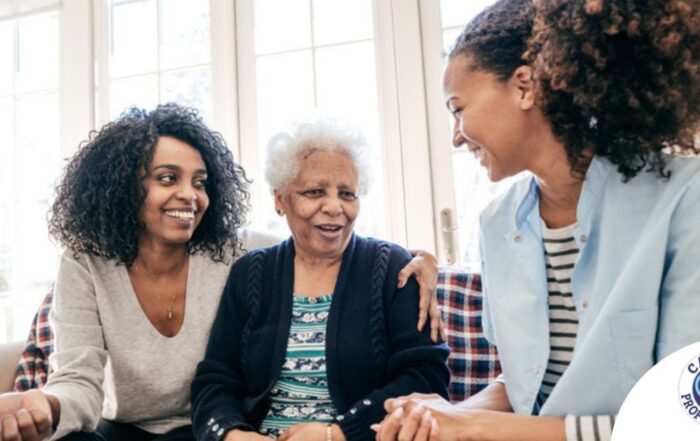 Caregiver talking to a family about Elderly Care
